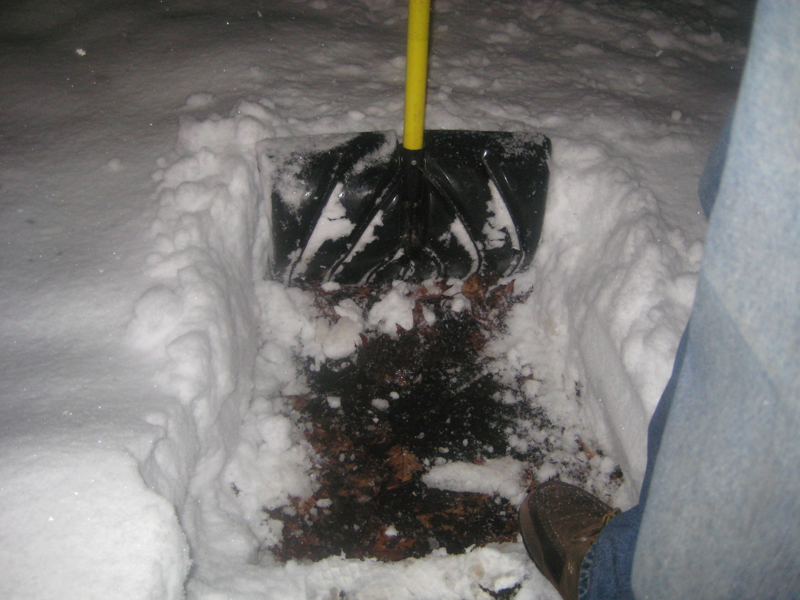 The snow reached the top of the shovel.